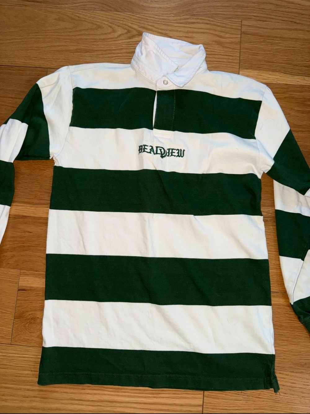 Green and White Striped Rugby Shirt with Chest Script